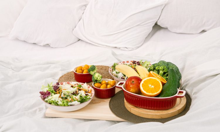 Healthy healthy Breakfast with fruit on a tray in bed. The concept of healthy eating .