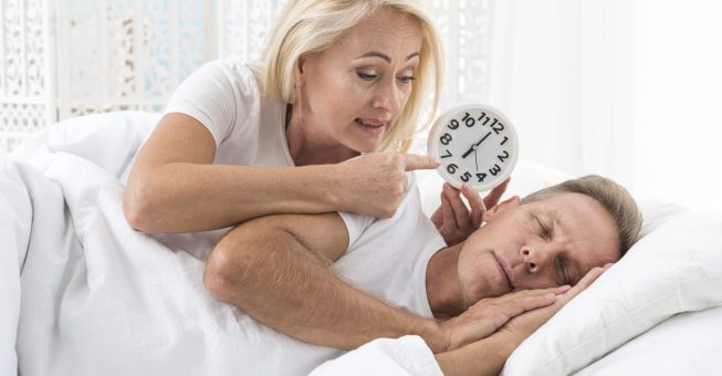 medium-shot-woman-waking-up-man