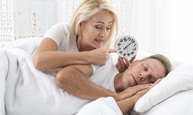 medium-shot-woman-waking-up-man