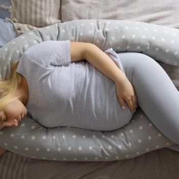 top-view-pregnant-woman-using-nursing-pillow