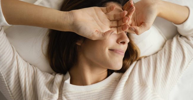 top-view-woman-bed-waking-up-home